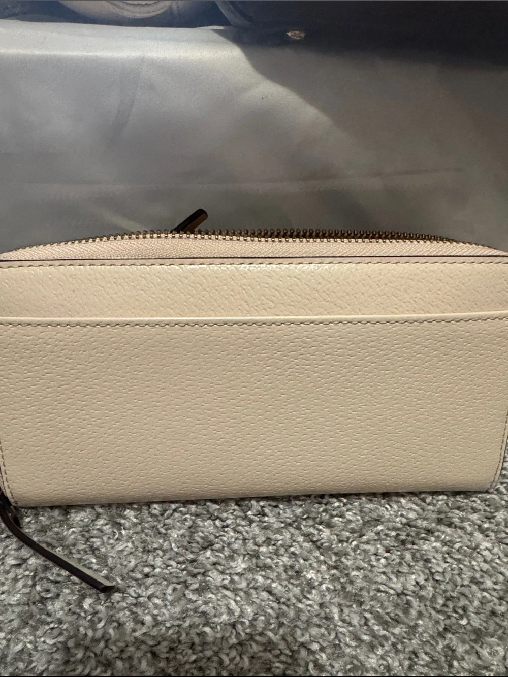 kate spade zip-around pebble leather wallet in light beige